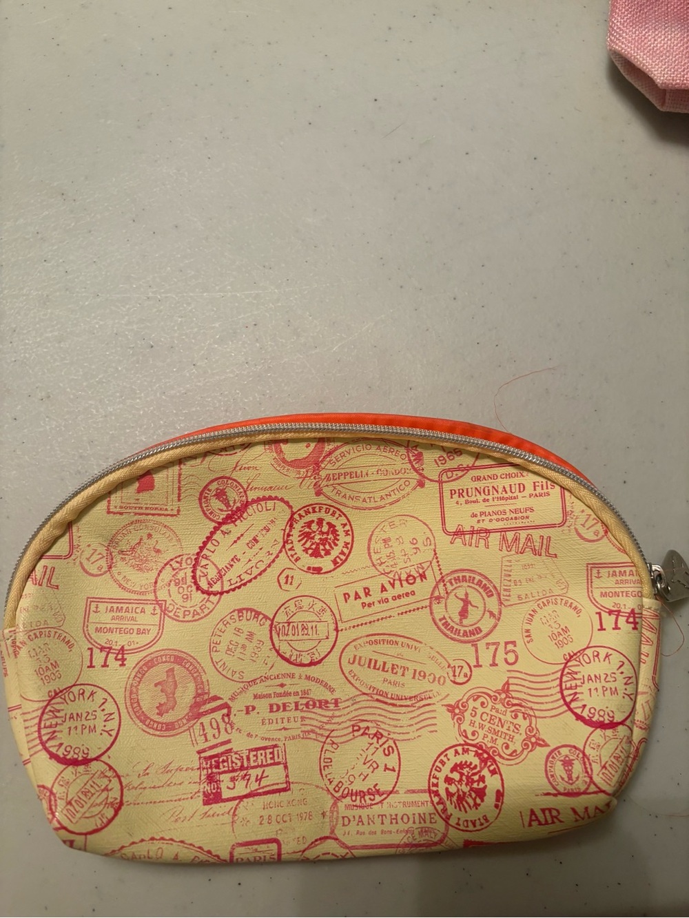 ipsy Cream Cosmetic Pouch with Pink Travel Stamp Print